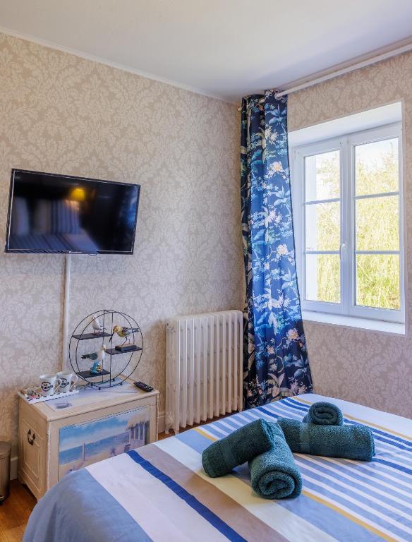 Postel nebo postele na pokoji v ubytování ARVEIL