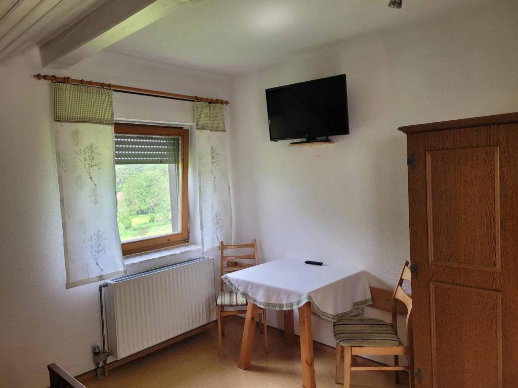 TV a/nebo společenská místnost v ubytování Haus Resi