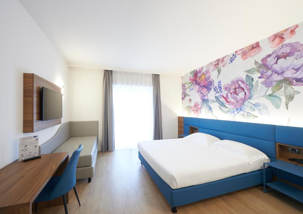 Postel nebo postele na pokoji v ubytování Palace Hotel Zingonia