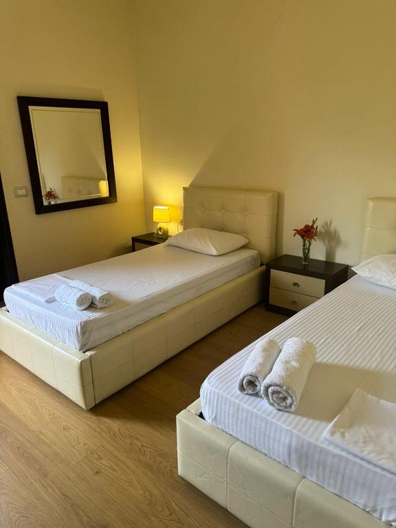Postel nebo postele na pokoji v ubytování Grand Park Hotel
