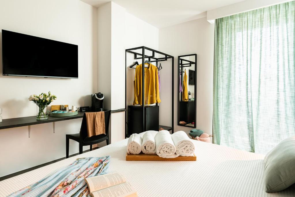 Postel nebo postele na pokoji v ubytování Verdeaqua Rooms