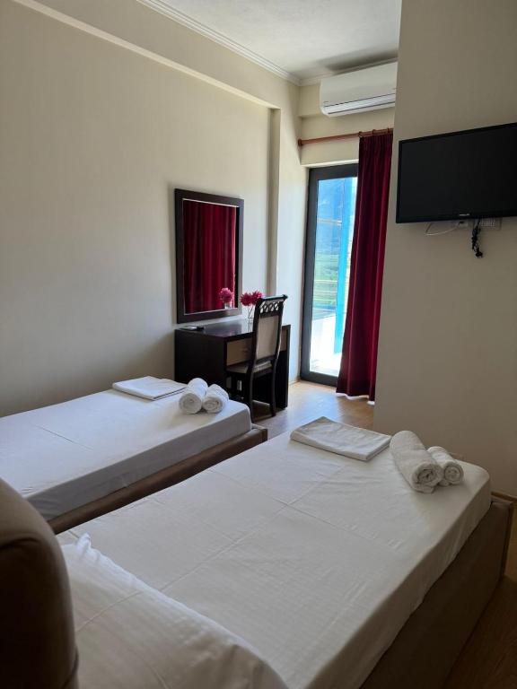 Postel nebo postele na pokoji v ubytování Grand Park Hotel