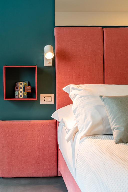 Postel nebo postele na pokoji v ubytování Verdeaqua Rooms