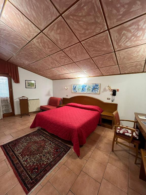 Postel nebo postele na pokoji v ubytování Hotel Cercone