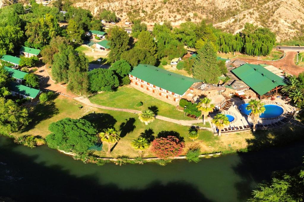 an aerial view of a house on an island in the water at Hotel Valle Grande in San Rafael
