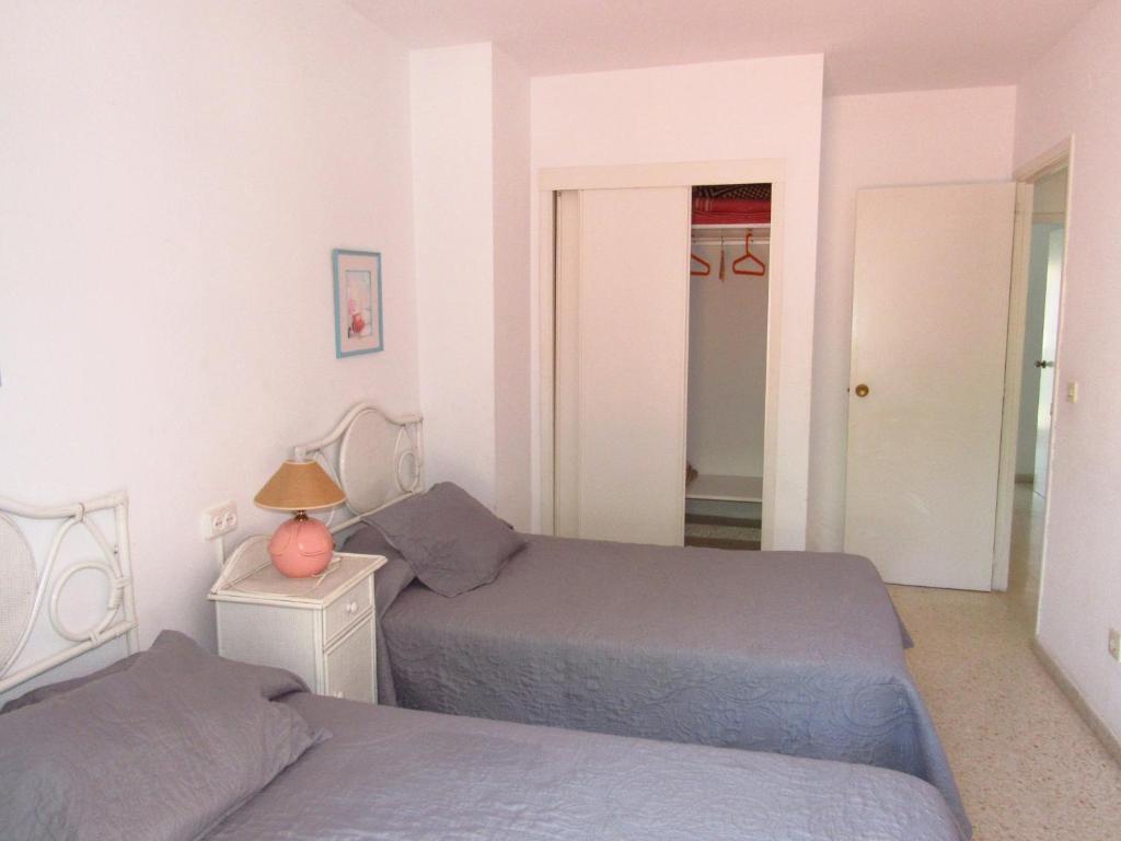 Postel nebo postele na pokoji v ubytování Pueblo Mar - Guadalmar