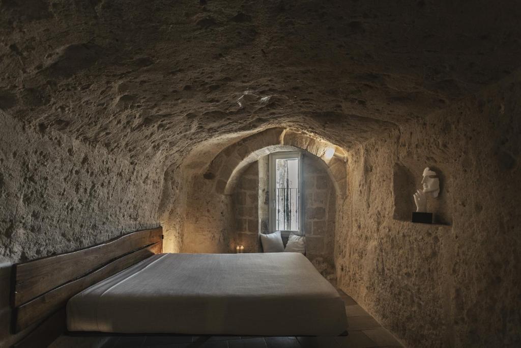 Postel nebo postele na pokoji v ubytování Aque cave