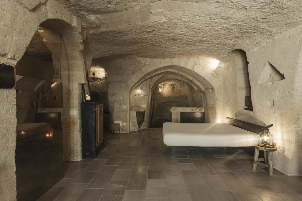 Postel nebo postele na pokoji v ubytování Aque cave