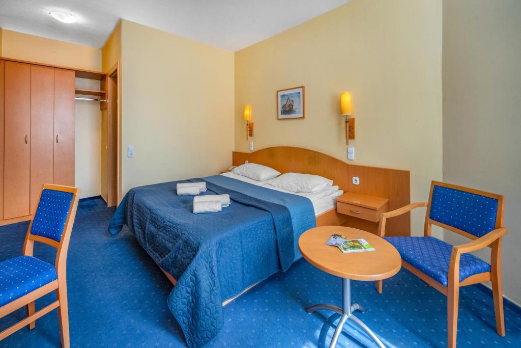Postel nebo postele na pokoji v ubytování Corvin Hotel Budapest Sissi Wing