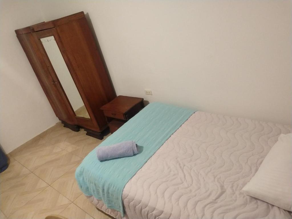 Postel nebo postele na pokoji v ubytování Casa Larimar