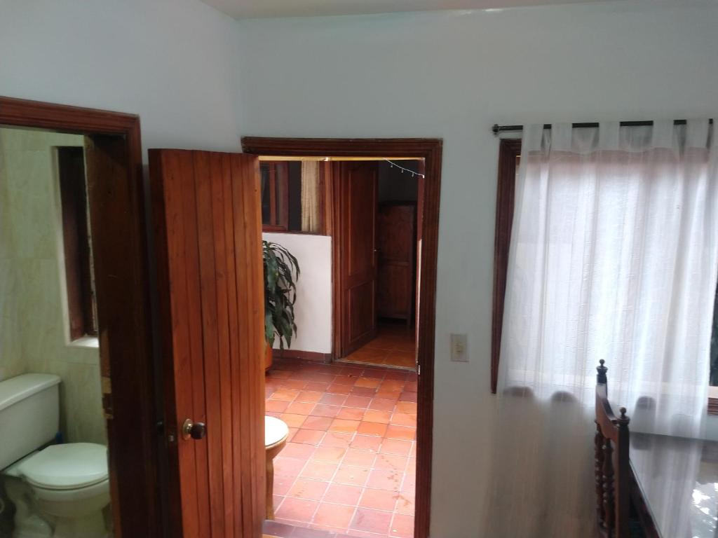 Postel nebo postele na pokoji v ubytování Casa Larimar