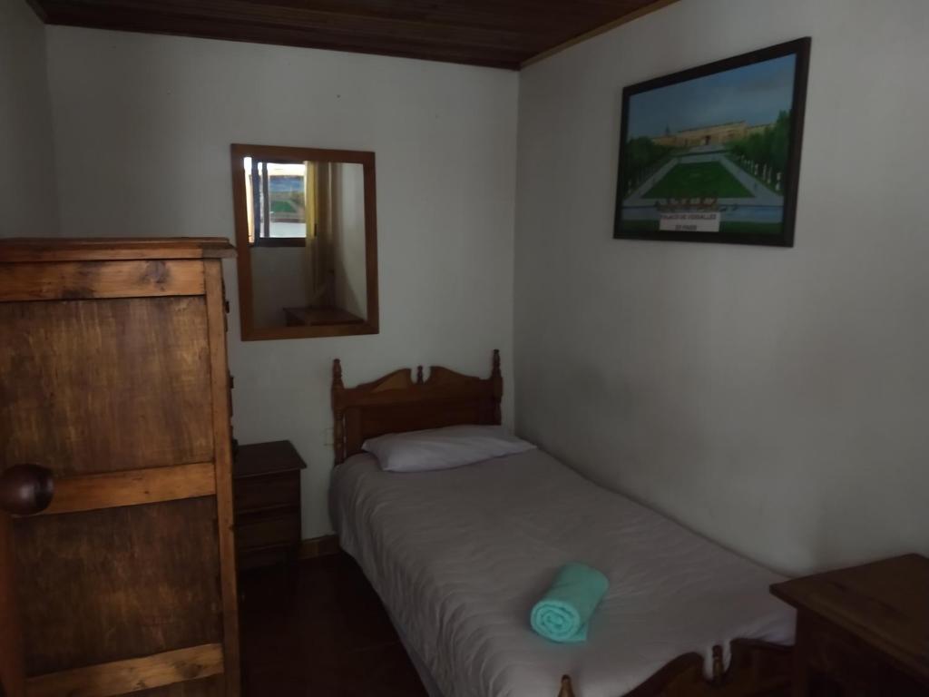 Postel nebo postele na pokoji v ubytování Casa Larimar