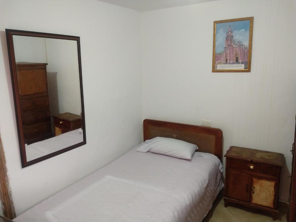 Postel nebo postele na pokoji v ubytování Casa Larimar