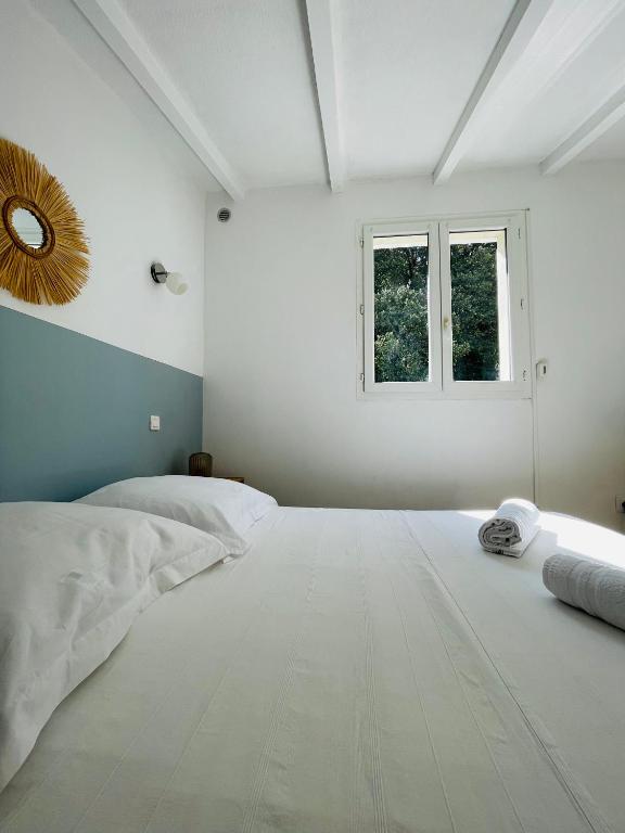Postel nebo postele na pokoji v ubytování Propriété Malva appartement margherita