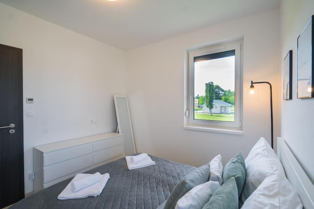 Postel nebo postele na pokoji v ubytování Blue Dream Apartman