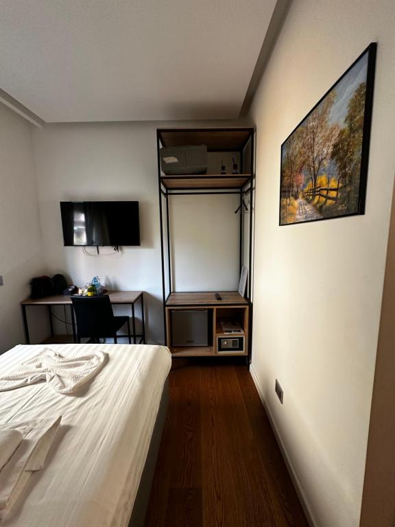 Postel nebo postele na pokoji v ubytování GRANDI 32 Boutique Residence