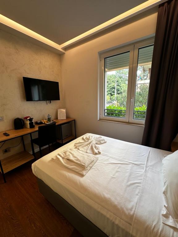 Postel nebo postele na pokoji v ubytování GRANDI 32 Boutique Residence