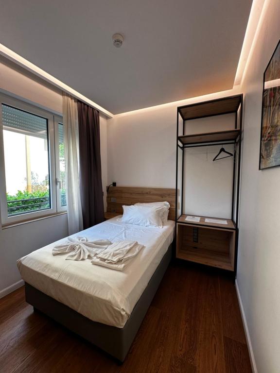 Postel nebo postele na pokoji v ubytování GRANDI 32 Boutique Residence