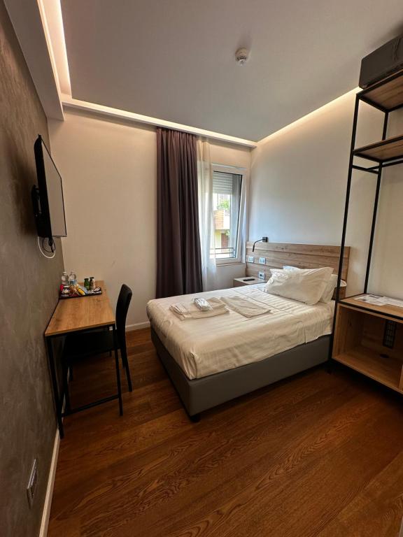 Postel nebo postele na pokoji v ubytování GRANDI 32 Boutique Residence