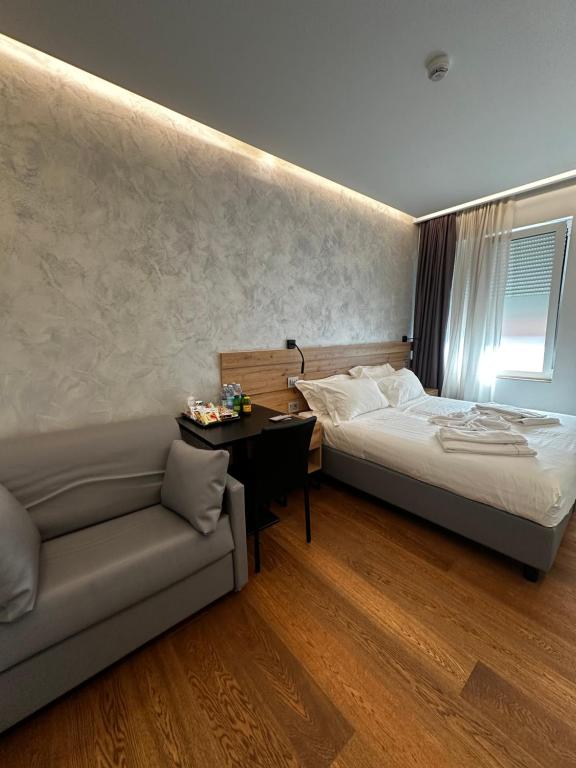Postel nebo postele na pokoji v ubytování GRANDI 32 Boutique Residence