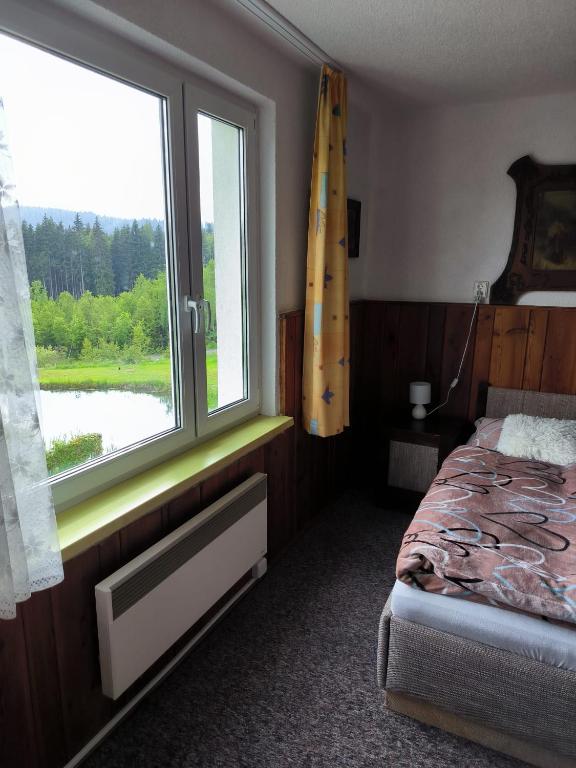 Postel nebo postele na pokoji v ubytování Chata Rybná 18