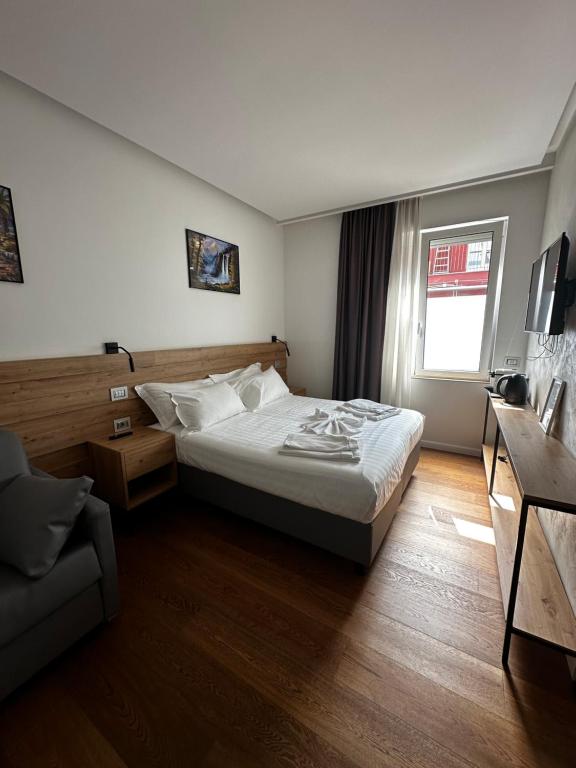 Postel nebo postele na pokoji v ubytování GRANDI 32 Boutique Residence