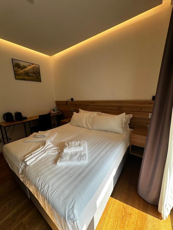 Postel nebo postele na pokoji v ubytování GRANDI 32 Boutique Residence