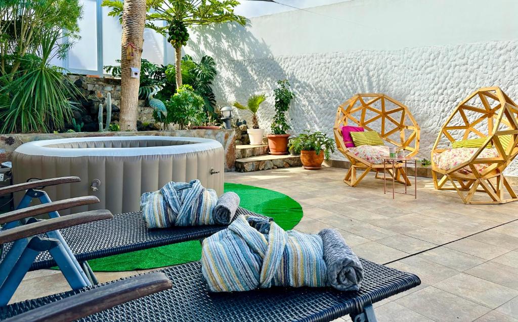 Khu vực ghế ngồi tại La Casita del Drago, sol y relax