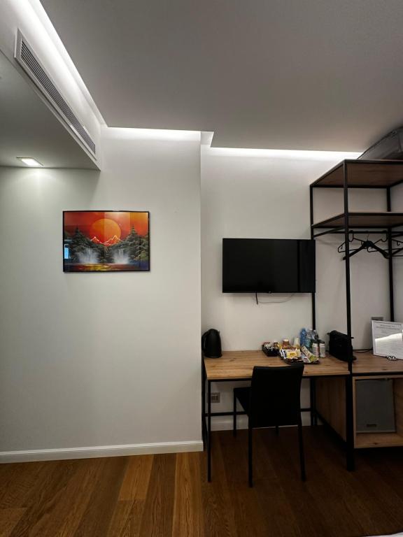TV a/nebo společenská místnost v ubytování GRANDI 32 Boutique Residence
