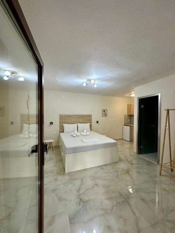 Postel nebo postele na pokoji v ubytování Hotel Argilos