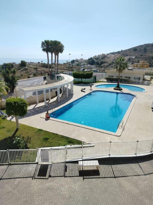 an overhead view of a large swimming pool at Apartment Cala Dor in El Campello