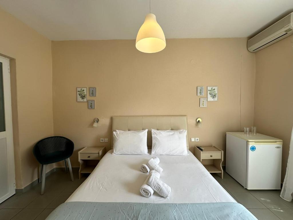 Postel nebo postele na pokoji v ubytování Hotel Argilos