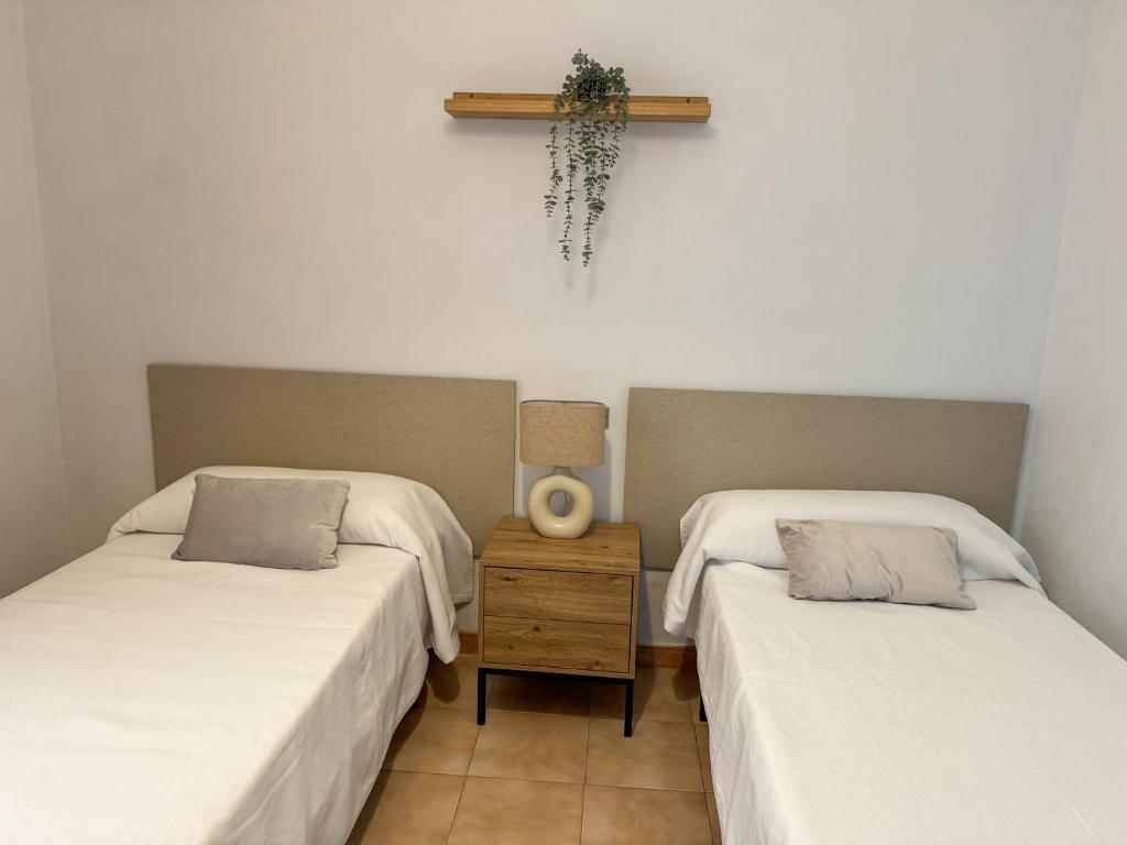 Postel nebo postele na pokoji v ubytování Apartamento LB, vistas a la ría