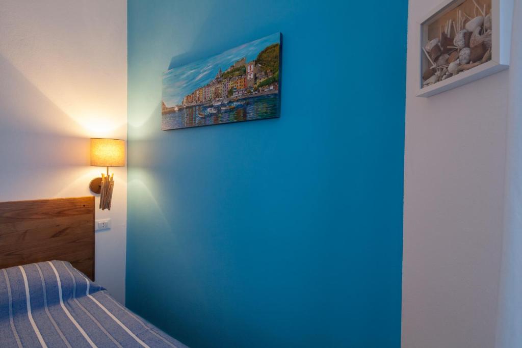 Postel nebo postele na pokoji v ubytování Cinque Terre Charme Rooms