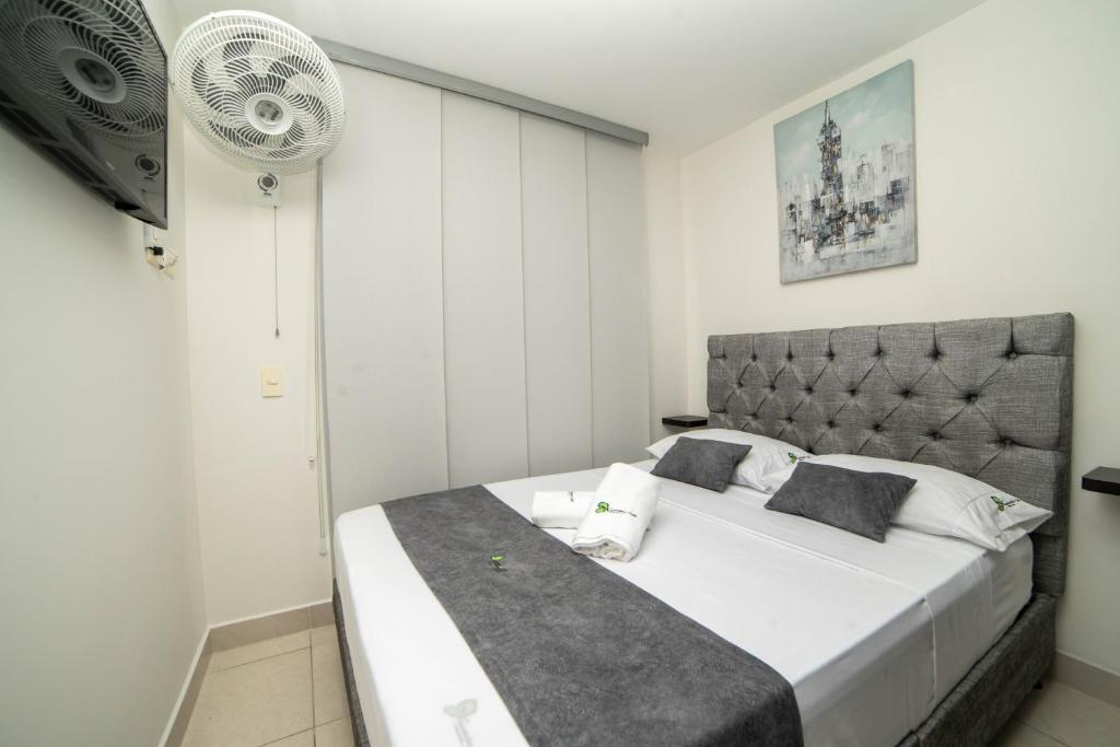 Postel nebo postele na pokoji v ubytování Apartahotel a 3km del parque del café