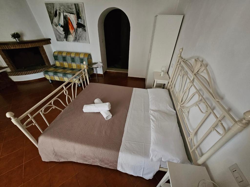 Postel nebo postele na pokoji v ubytování Quattro Olive