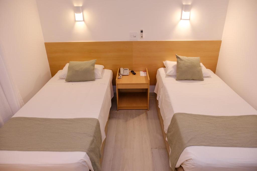 Cama ou camas em um quarto em Marante Plaza Hotel