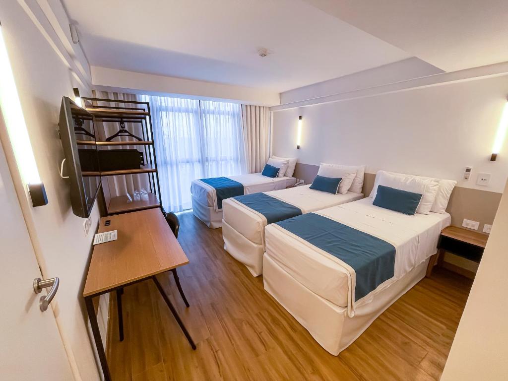 Cama ou camas em um quarto em Marante Plaza Hotel