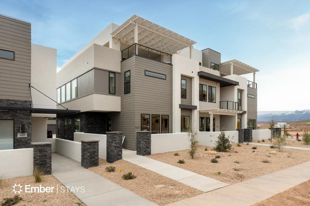 a large white building with a lot of windows at The Solace at Desert Color by Ember Stays in St. George