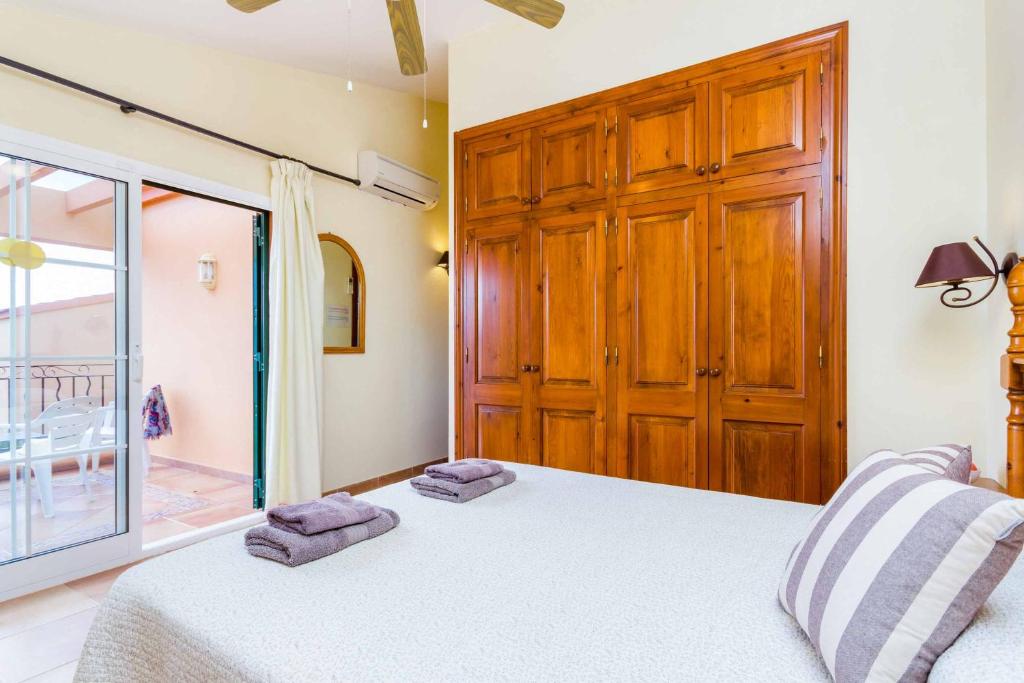Postel nebo postele na pokoji v ubytování Villa Marcolis Playa