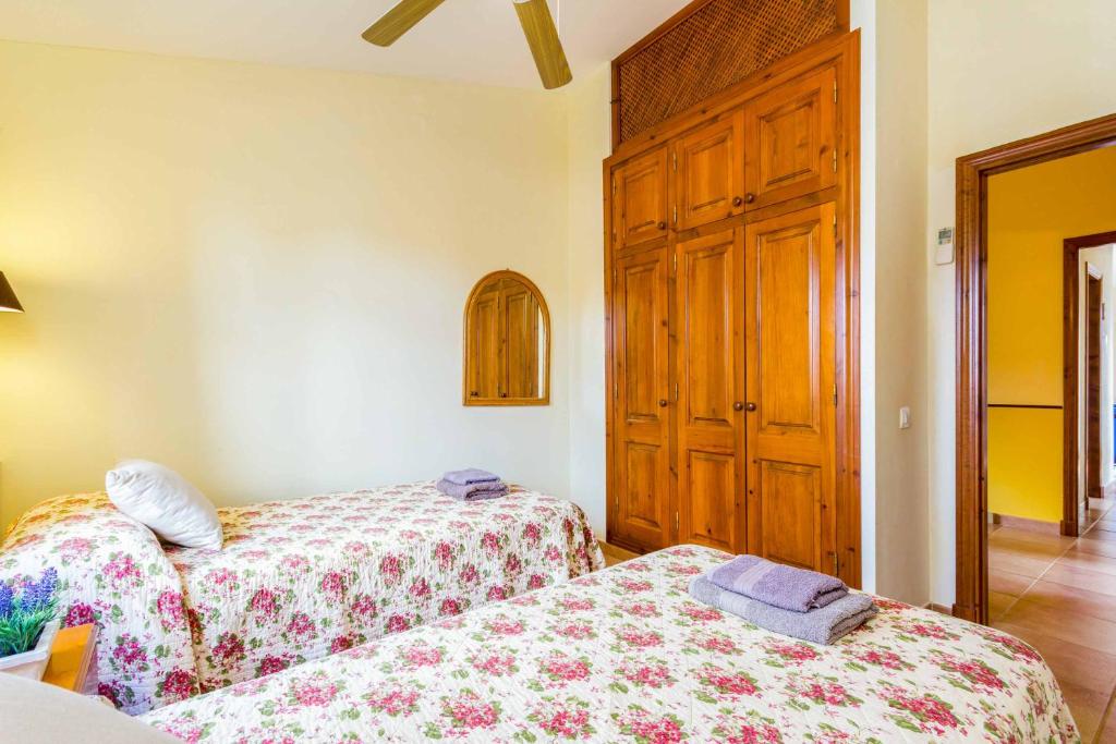 Postel nebo postele na pokoji v ubytování Villa Marcolis Playa