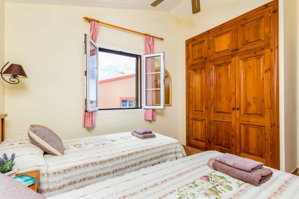 Postel nebo postele na pokoji v ubytování Villa Marcolis Playa