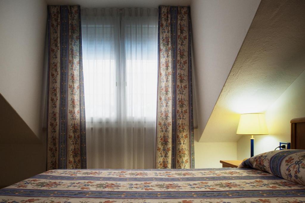 Postel nebo postele na pokoji v ubytování Hotel Caracas