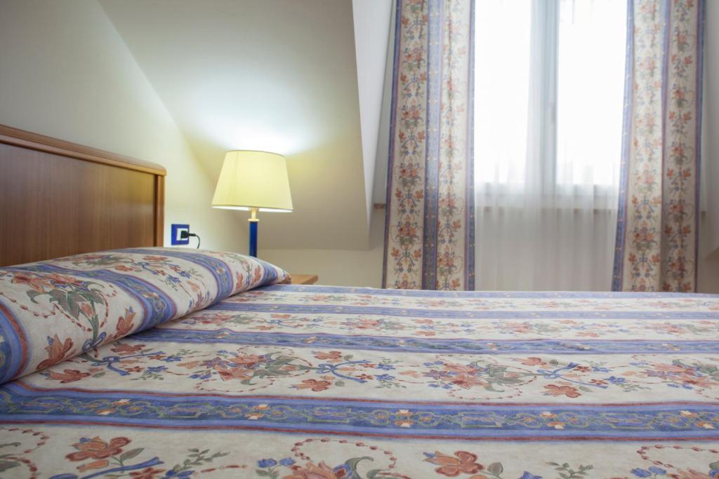 Postel nebo postele na pokoji v ubytování Hotel Caracas