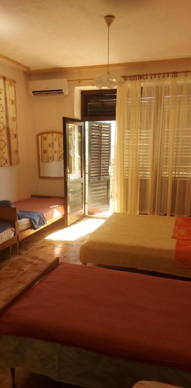 Postel nebo postele na pokoji v ubytování Apartmani Vesna