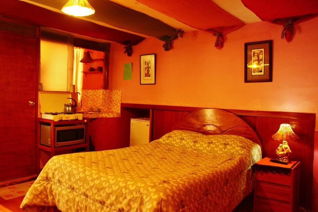 a bedroom with a large bed in a room at Casa De Mama Cusco - The Treehouse in Cusco