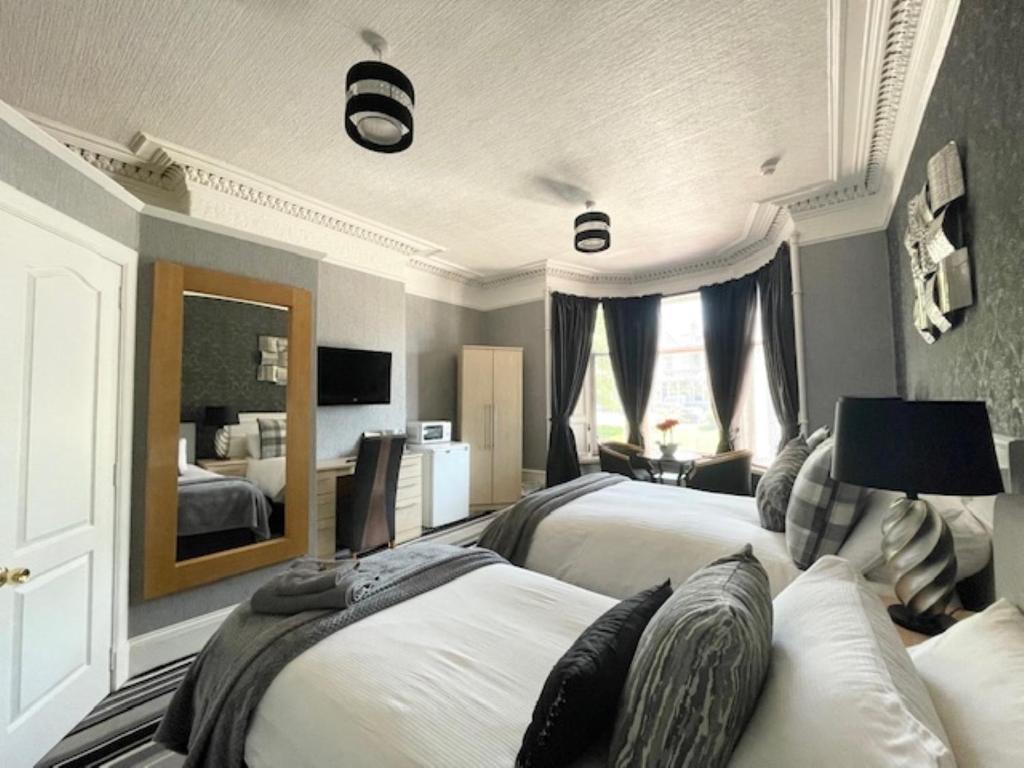 Postel nebo postele na pokoji v ubytování Vaila Guest House