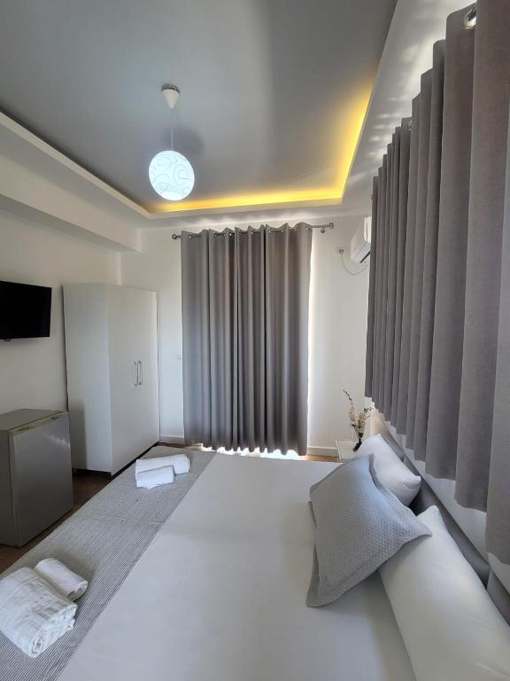 Postel nebo postele na pokoji v ubytování Hotel Myrtai - City Center