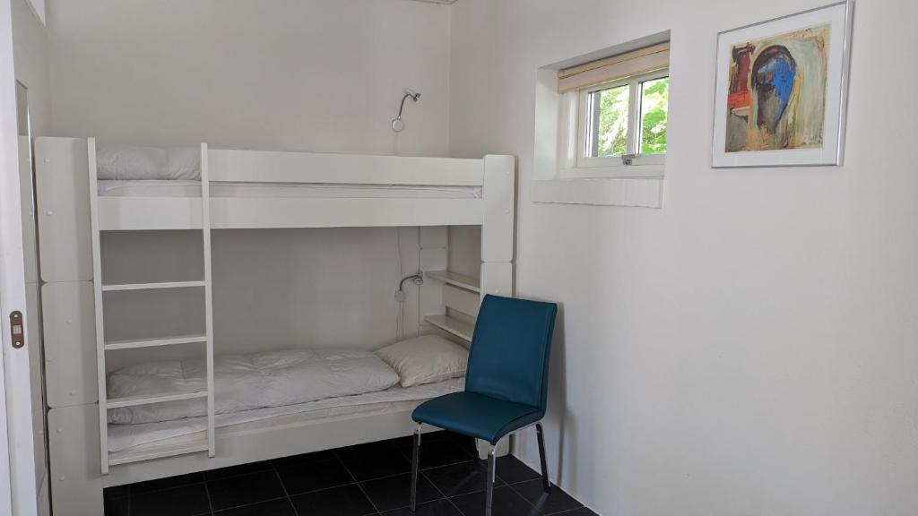 Postel nebo postele na pokoji v ubytování Tversted Strandpark