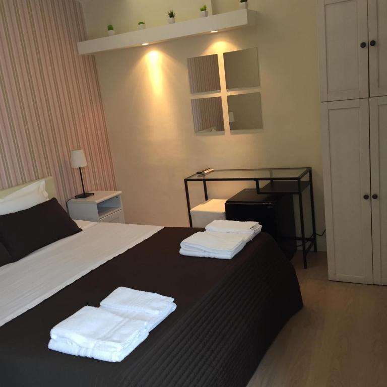 Postel nebo postele na pokoji v ubytování Reggio Centro B&B